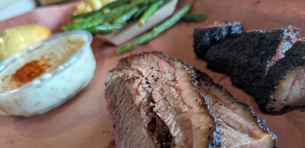 Brisket slices on a tray at Terry Black's BBQ